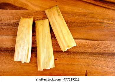 Homemade Mexican Tamales On A Wooden Board