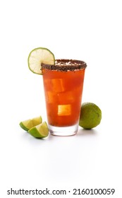 Homemade michelada cocktail with beer, lime juice,hot sauce,salted Rim and tomato juice isolated on white background. 