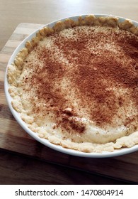 Homemade Milk Tart On Wooden Plank