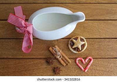 Homemade Mince Pie And Cream With Candy Canes And Cinnamon, Traditionally Left Out For Father Christmas On Christmas Eve