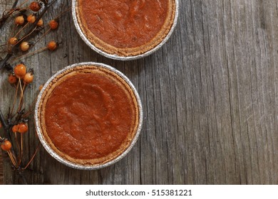 Homemade Mini Pumpkin Pie  Tarts On Wooden Background Top Down View