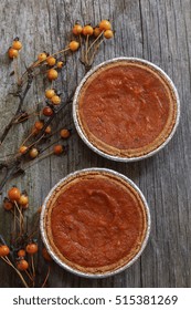 Homemade Mini Pumpkin Pie Tarts  On Wooden Background Top Down View