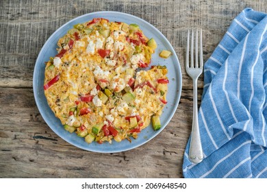 Homemade Mixed Veggie And Cheese Omelet On Wooden Table For Breakfast