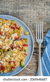 Homemade Mixed Veggie And Cheese Omelet On Wooden Table For Breakfast