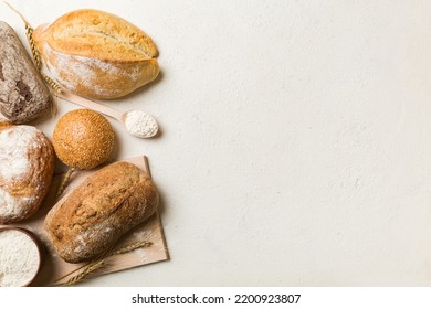 Homemade natural breads. Different kinds of fresh bread as background, top view with copy space.