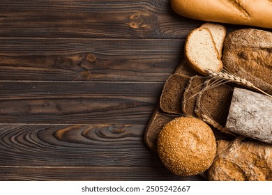 Homemade natural breads. Different kinds of fresh bread as background, top view with copy space. - Powered by Shutterstock