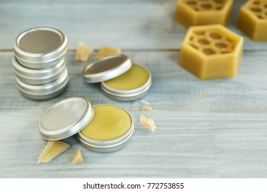 Homemade Natural Lip Balm On White Wooden Table