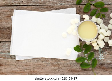 homemade natural lip balm in tin pots on blank recipe paper, how to make homemade natural lip balm, D.I.Y. projects,

