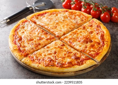 Homemade New York style pizza with mozzarella cheese and spicy tomato sauce close-up on a wooden board on the table. Horizontal
 - Powered by Shutterstock
