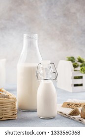 Homemade Nut Milk In Bottles And Raw Brazil Nuts. Milk Substitute.