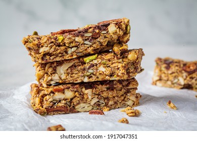 Homemade oat bars with berries and nuts, light background. Energy Protein Healthy Bars. Vegan dessert concept. - Powered by Shutterstock
