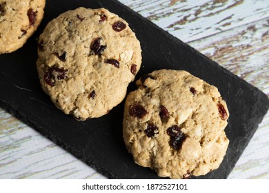 Homemade Oatmeal And Blueberry Cookies On White Wood - Healthy Food And Snacks