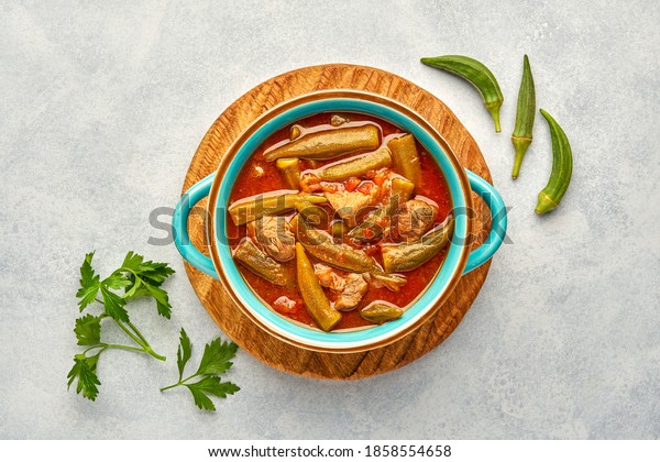  Homemade okra and meat stew in a
pot. Top view, copy space                            
