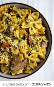 Homemade One-Pot Chicken And Mushroom Pasta In A Bowl On A White Wooden Background, Top View. Flat Lay, Overhead, From Above. 