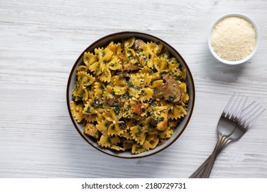 Homemade One-Pot Chicken And Mushroom Pasta In A Bowl On A White Wooden Surface, Top View. Flat Lay, Overhead, From Above. 