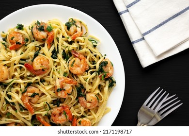 Homemade One-Pot Lemon Garlic Shrimp Pasta On A Plate On A Black Background, Top View.