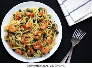 Homemade One-Pot Lemon Garlic Shrimp Pasta On A Plate On A Black Background, Top View.