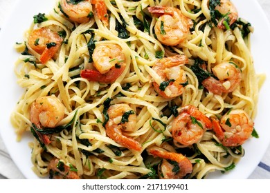 Homemade One-Pot Lemon Garlic Shrimp Pasta On A Plate, Top View. Flat Lay, Overhead, From Above.