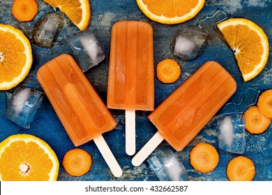 Homemade Orange And Carrot Natural Juice Popsicles With Turmeric, Honey And Ginger