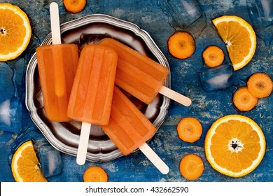 Homemade Orange And Carrot Natural Juice Popsicles With Turmeric, Honey And Ginger