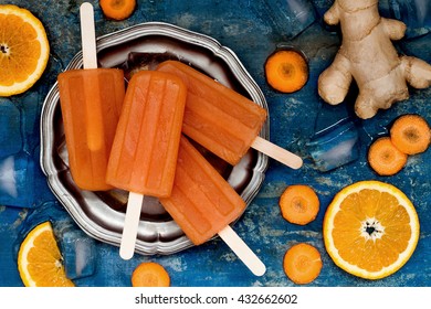 Homemade Orange And Carrot Natural Juice Popsicles With Turmeric, Honey And Ginger