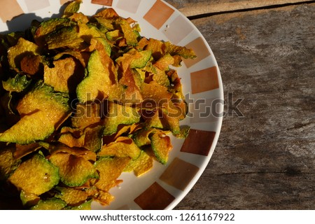 homemade organic baked pumpkin chips served on dish