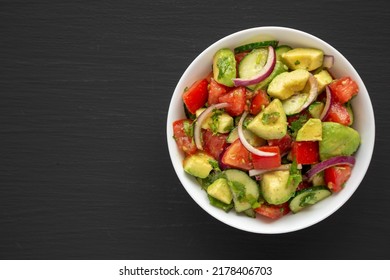 Homemade Organic Cucumber, Tomato And Avocado Salad In A Bowl, Top View. Flat Lay, Overhead, From Above. Space For Text.