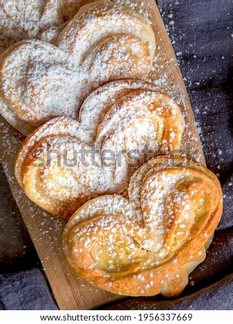 Homemade Palmier Puff Pastry. Delicious french palmier cookies with sugar. Palmiers, elephant ear, puff pastry cookie.