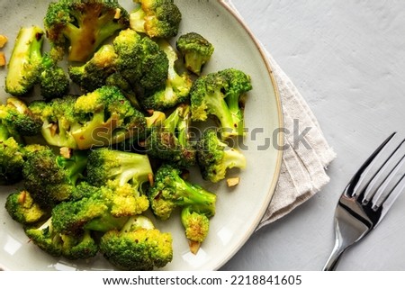 Homemade Pan-Fried Broccoli on a Plate, top view. Flat lay, overhead, from above. Close-up.