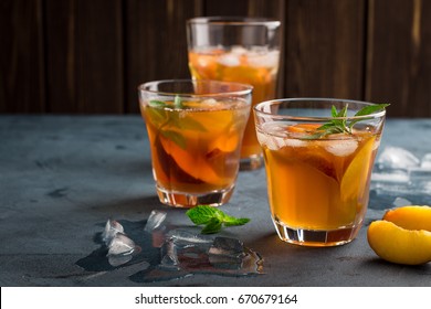 Homemade Peach And Lemon Ice Tea With Mint On Rustic Background 