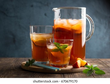 Homemade Peach And Lemon Ice Tea With Mint On Rustic Background 