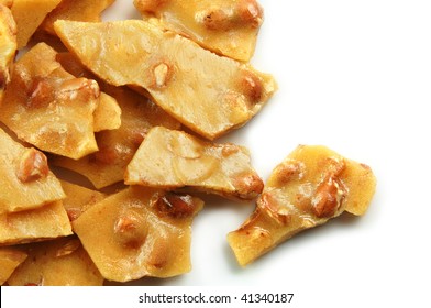 Homemade Peanut Brittle On A White Background