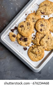 Homemade Peanut Butter Cookies With Chocolate Chunks On Metallic Tray; Overhead Shot