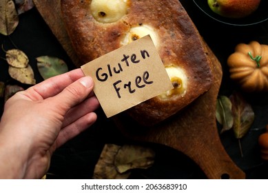 Homemade Pear Pie, Top View.
Gluten Free Baked Goods. A Female Hand Holds A Postcard With The Inscription Gluten Free.