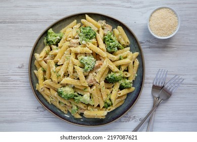 Homemade Penne Alfredo Pasta With Chicken And Broccoli On A Plate, Top View. Flat Lay, Overhead, From Above. 