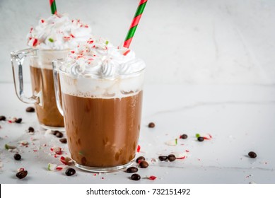 Homemade Peppermint Mocha, Christmas Coffee Drink With Candy Canes, Whipped Cream And Mint Syrup , On White Marble Table, Copy Space