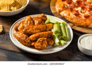 Homemade Pepperoni Pizza Chicken Wings And Beer For A Football Party