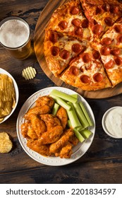 Homemade Pepperoni Pizza Chicken Wings And Beer For A Football Party