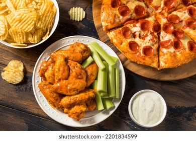 Homemade Pepperoni Pizza Chicken Wings And Beer For A Football Party