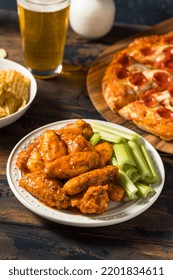 Homemade Pepperoni Pizza Chicken Wings And Beer For A Football Party