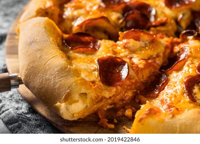 Homemade Pepperoni Stuffed Crust Pizza with Cheese - Shutterstock ID 2019422846