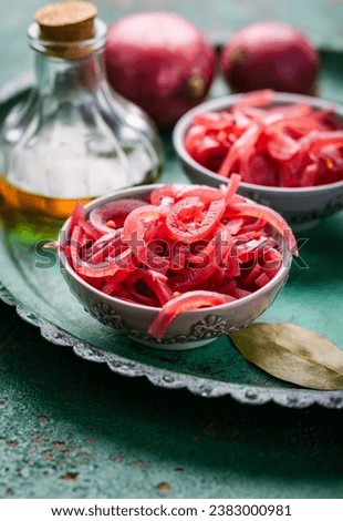 Homemade pickled sliced red onions with ingredients