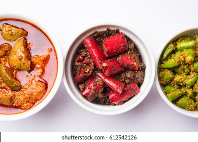 Homemade Pickles of Red/Green Chilli and Mango, also known as Mirchi and Aam ka achar Served in bowls, selective focus
