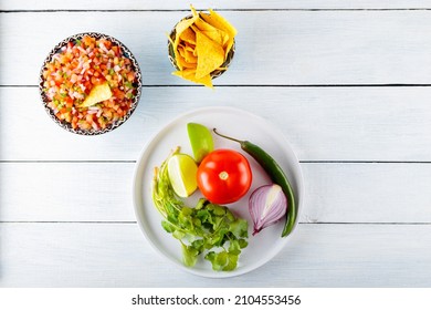 Homemade Pico De Gallo Salsa And Ingredients. Bowl Of Spicy Pico De Gallo Salsa On White Boards. Top View