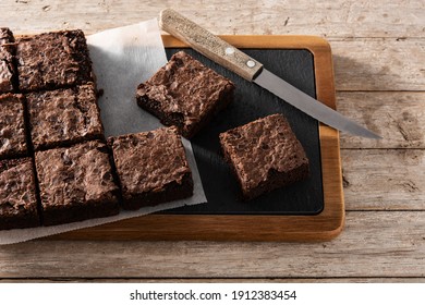 Homemade pieces of brownies on wooden table