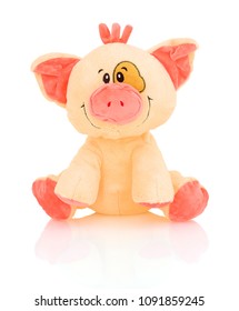 Homemade pig plushie doll isolated on white background with shadow reflection. Pink hog stuffed puppet isolated on white backdrop.