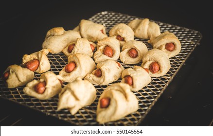 Homemade Pigs In A Blanket On Baking Rack.