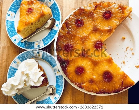 Homemade pineapple upside down cake with candied cherries on wooden background. Directly above.