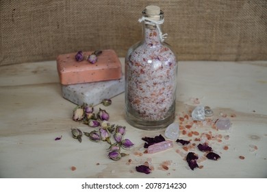                       Homemade Pink Bath Salt With Epsom And Himalayan Salt, Essential Oils And Wild Rose Petals. Natural Soaps And Crystals On Blurred Beige Background.                 