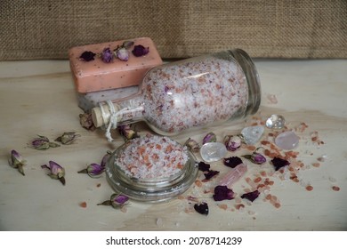                       Homemade Pink Bath Salt With Epsom And Himalayan Salt, Essential Oils And Wild Rose Petals. Natural Soaps And Crystals On Blurred Beige Background.                 